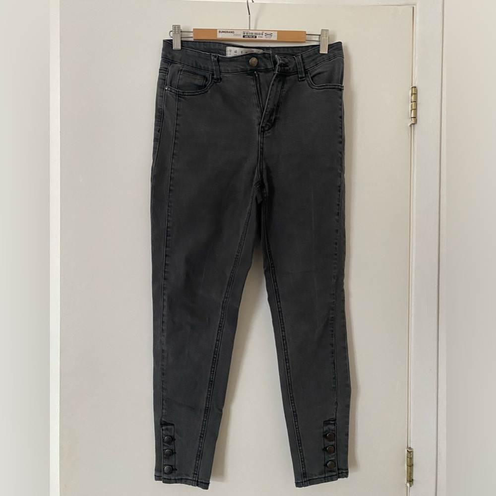 Dark grey skinny jeans with button details